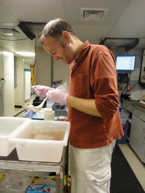 Rob sorting through a nighttime plankton sample collected on the RV Atlantic Explorer research cruise examining marine food webs in the Sargasso Sea.