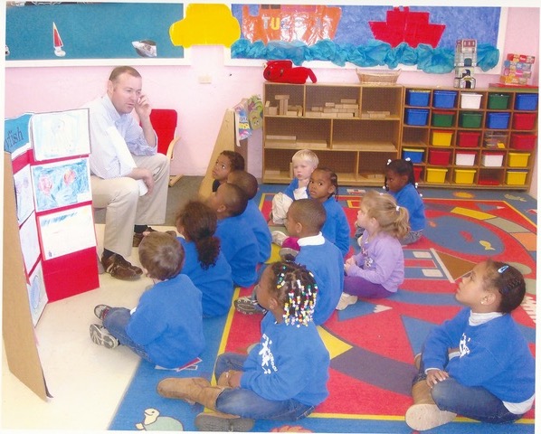 Rob talking with St. Georges Preschool children in Bermuda about jellyfish and ocean animals. The jellyfish pictures were entries submitted by the children as part of an International Jellyfish Art Contest he conducted, in which over 500 children from 26 different countries participated.